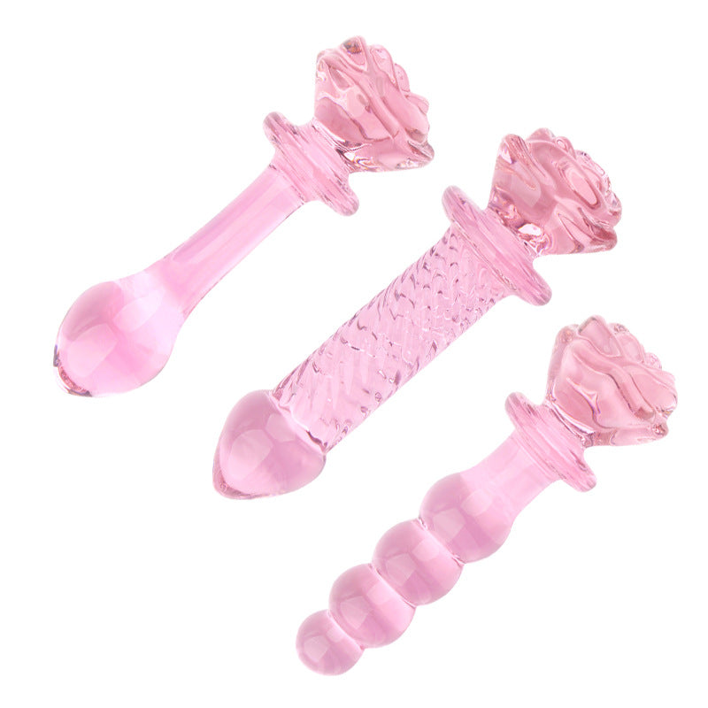 Różowe szklane dildo z różą — widok dwóch produktów po skosie